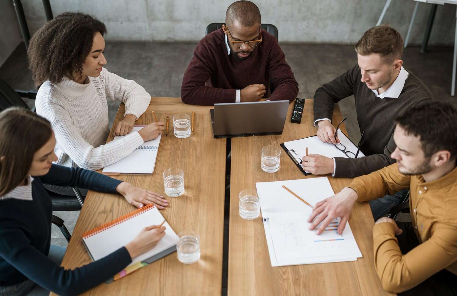 People working together at a meeting table