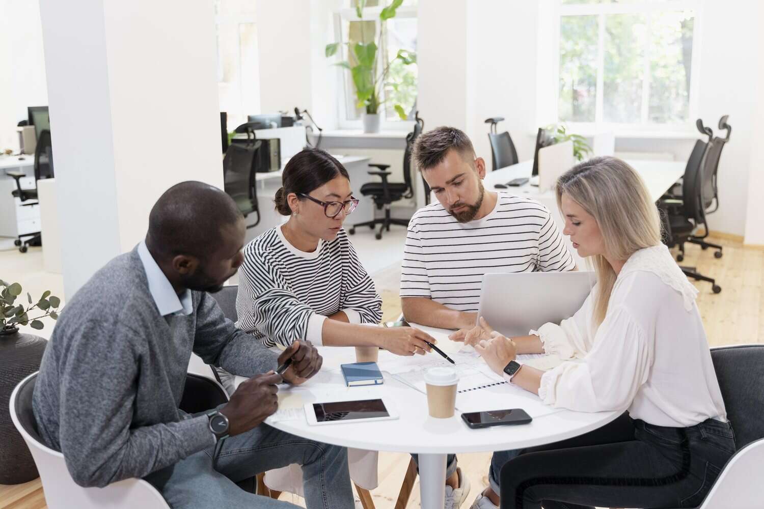 Colleagues sharing ideas in a bright office